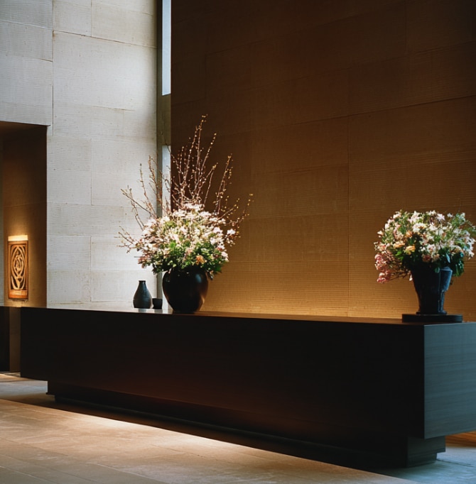 Stylish modern office lobby with floral decor, representing professional spaces financed through commercial loans
